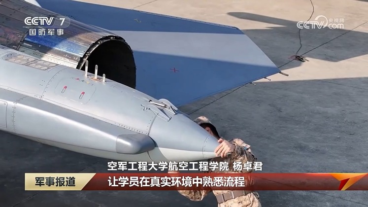 Chinese Ground Crew at the Air Force Engineering University Work on Tail of J-11A Fighter