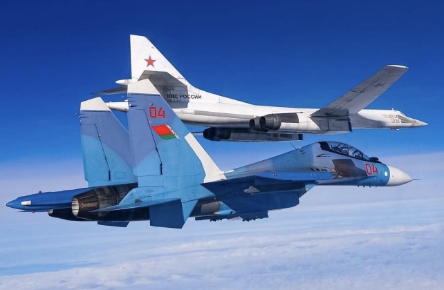 Belarusian Su-30SM Escorts Russian Tu-160 Strategic Bomber Over Belarus