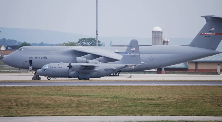 C-5 Heavy Transport Next to C-130 Medium Transport For Scale C-5 Heavy Transport Next to C-130 Medium Transport For Scale