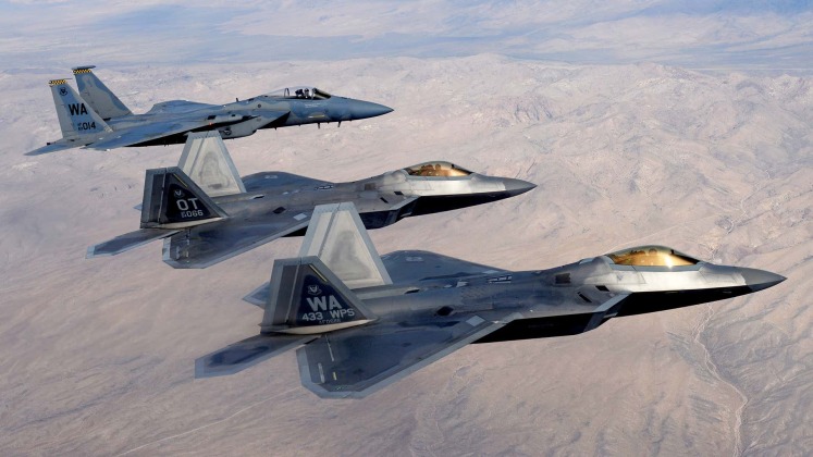 U.S. Air Force F-22 Fighters Followed by F-15C