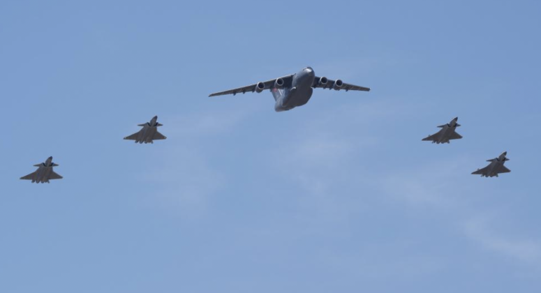 J-20 Fighters Escourt Y-20B with Remains of Korean War Martyrs