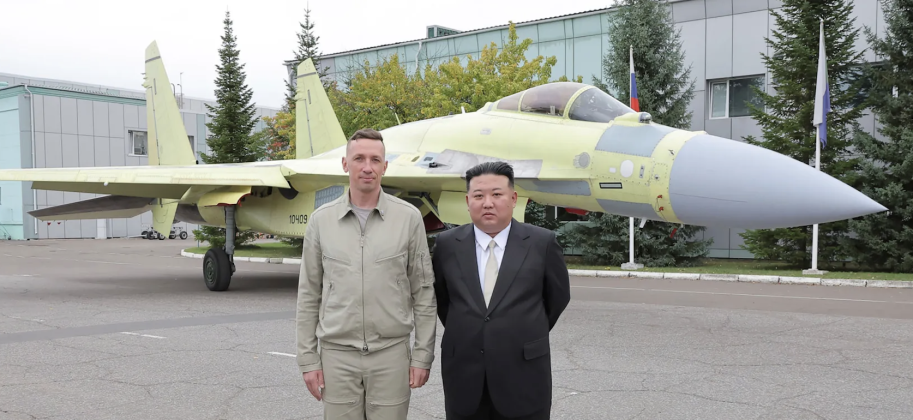 North Korean Leader Chairman Kim Jong Un with Su-35 Fighter and Pilot at the Komsomolsk on Amur Aircraft Plant