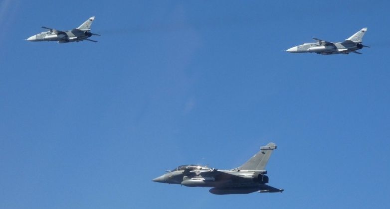 French Air Force Rafale (bottom) and Russian Su-24M Fighters