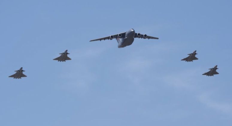 J-20 Fighters Escourt Y-20B with Remains of Korean War Martyrs