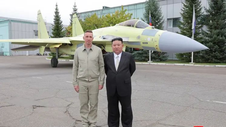 North Korean Leader Chairman Kim Jong Un with Su-35 Fighter and Pilot at the Komsomolsk on Amur Aircraft Plant