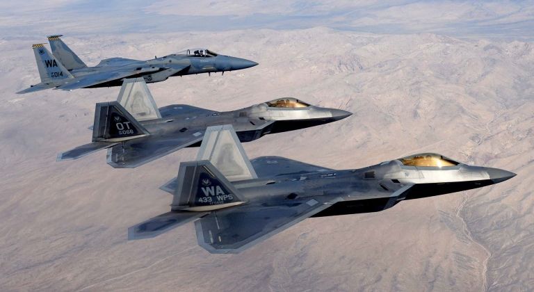 F-22s and F-15 in Formation
