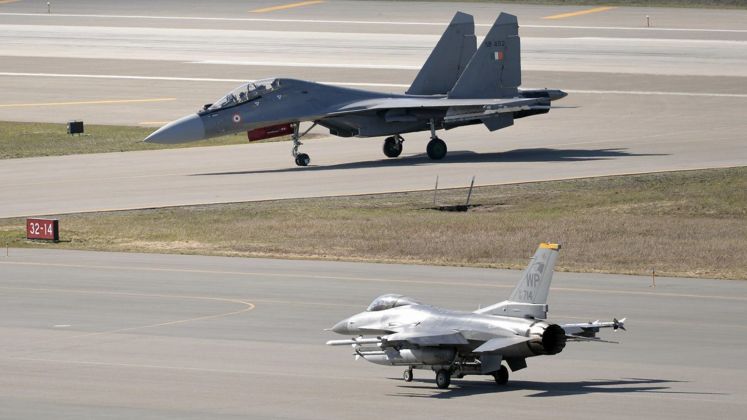 F-16 (front) and Su-30 Fighters