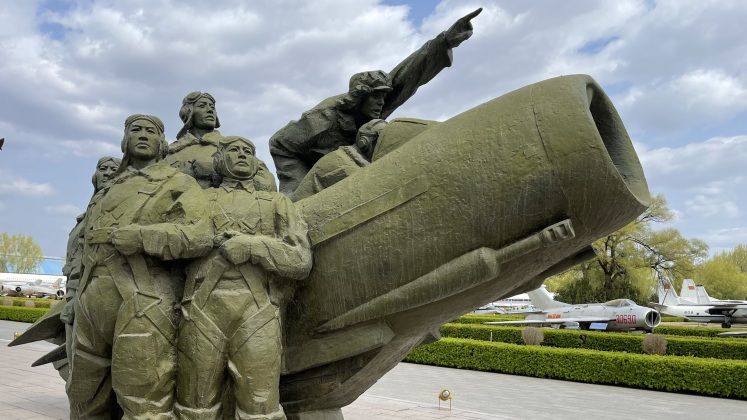 Statue Commemorating PLA Airmen with MiG-15 (J-6 in Background)
