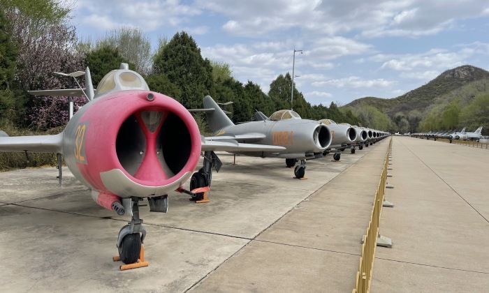 MiG-15 at the Head of a Lineup of MiGs, J-5s and J-6s, with J-7s to the Right