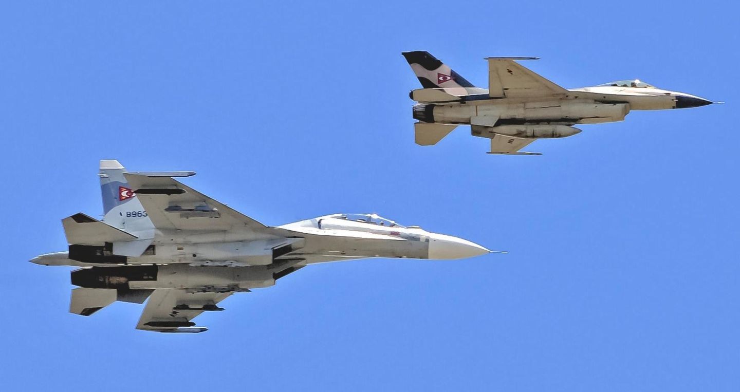 Venezuelan Air Force F-16 (front) and Su-30MK2