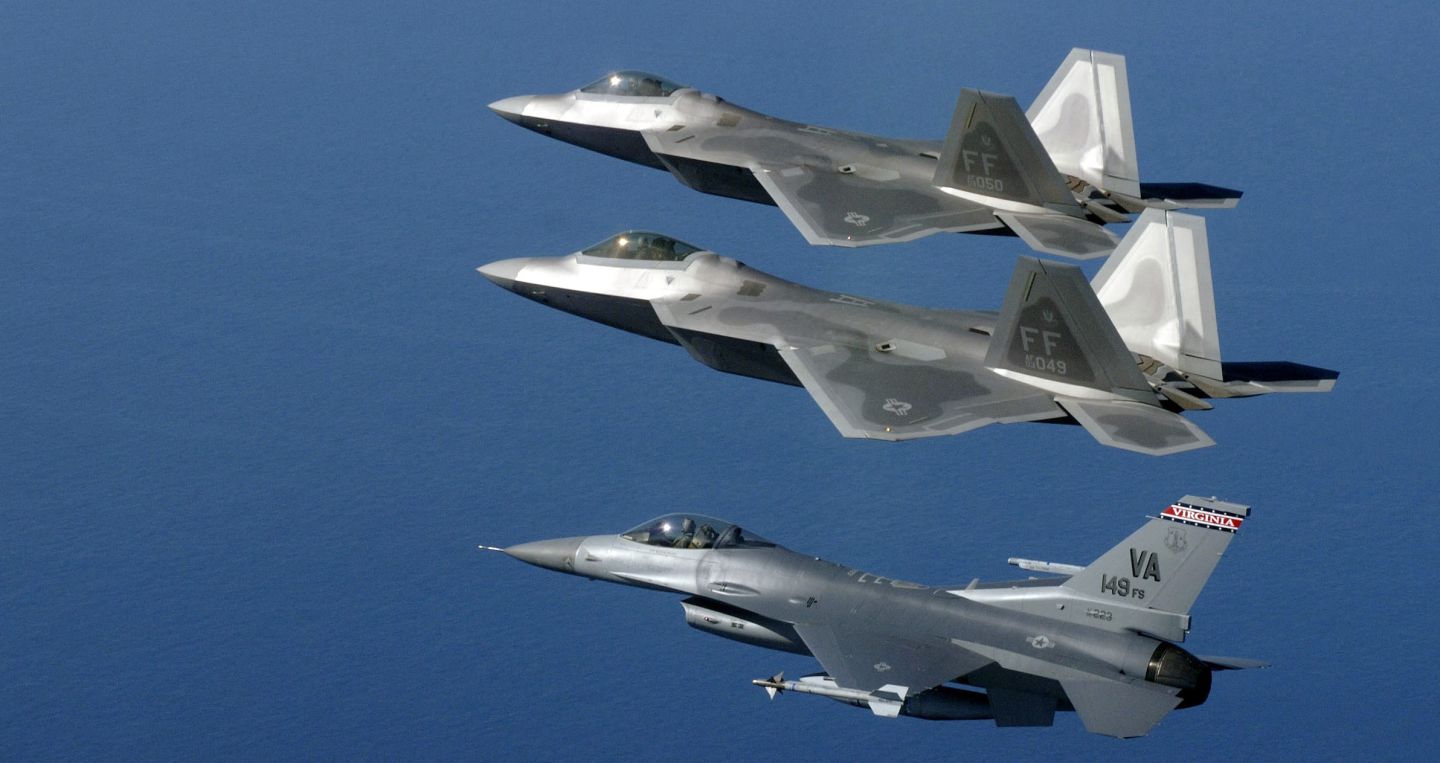 U.S. Air Force F-16 Fighting Falcon and F-22 Raptors