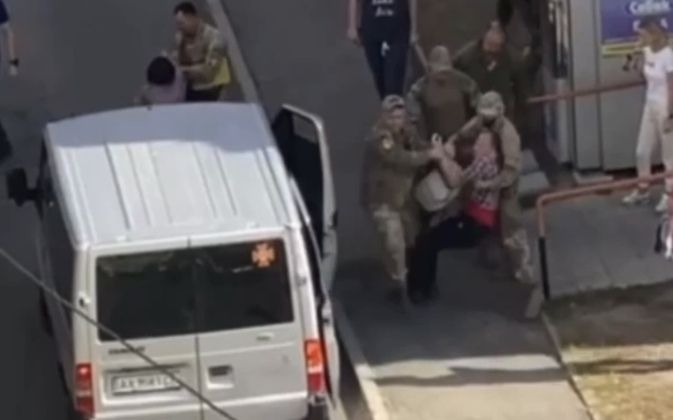 Ukrainian Man Being Dragged Into Van For Conscription