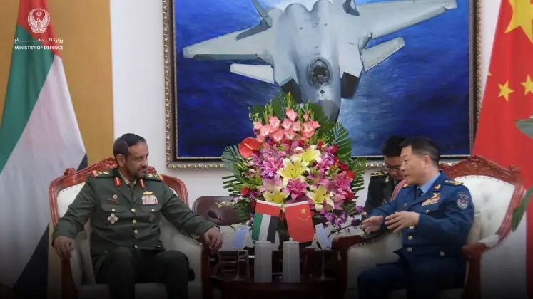 Chinese and UAE Defence Officials Meet in Front of J-20 Fighter Image