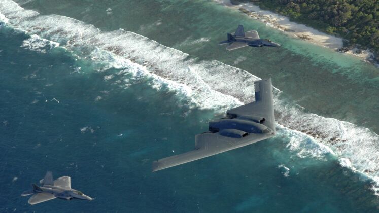F-22s Escort B-2 Bomber Over Guam