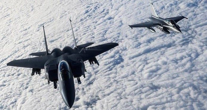 F-15 (left) and Rafale Fighters