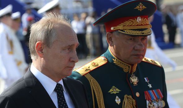 Russian President Vladimir Putin and Defence Minister Sergei Shoigu