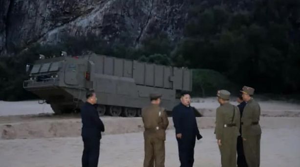 North Korean Military Leadership Inspect New Missile Launcher