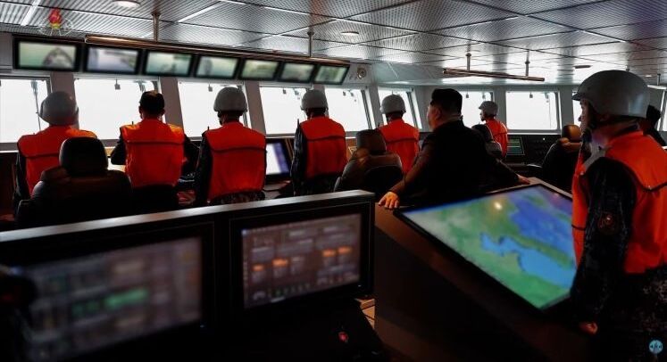 Personnel Onboard North Korean Destroyer Kang Kon During First Sea Trials